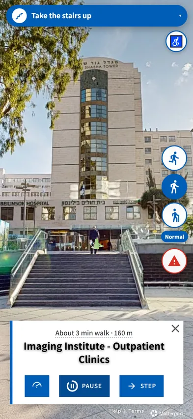 Outdoor plaza on the campus with the instruction Take the stairs up